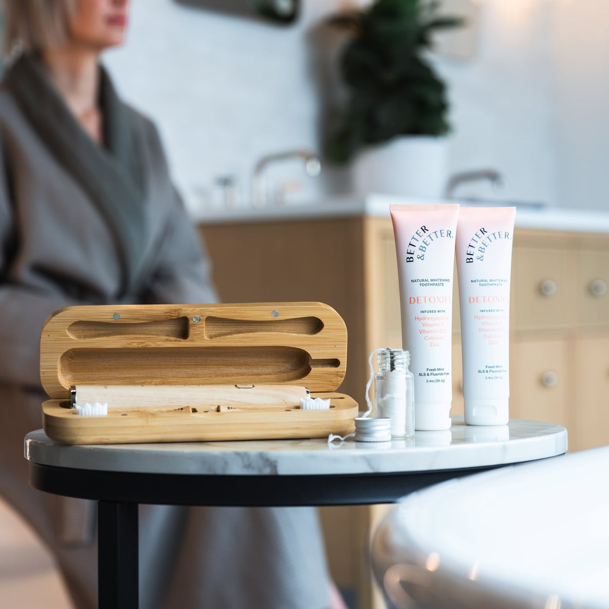 Two tubes of Detoxify Zinc Toothpaste on a bathroom counter